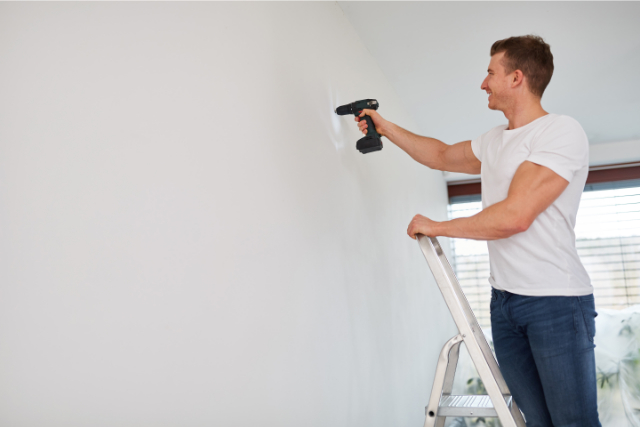 Billings Man Works with a Power Drill